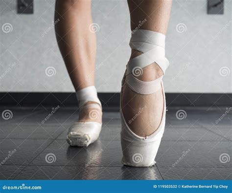 Close Up View Of A Ballerina Ballet Dance Warming Up Her Feet In