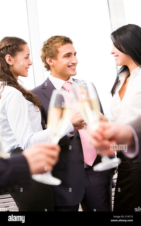 Image Of Cheering Friends Interacting At Corporate Party Stock Photo