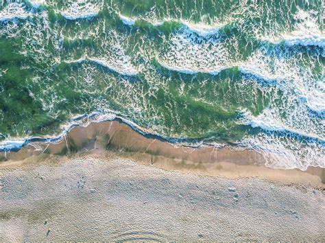 Aerial View Of Ocean Waves Crashing On Beach Photograph By Cavan