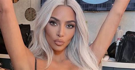 Kim Kardashian Risks Overexposure As She Slips Famous Curves Into Cut