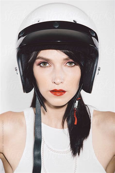 Closeup Of Stylish Girl In A Motorcycle Helmet On White Backgrou By Stocksy Contributor A
