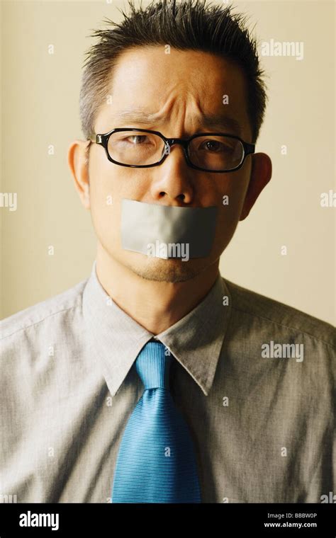 Man With Tape Over Mouth Stock Photo Alamy