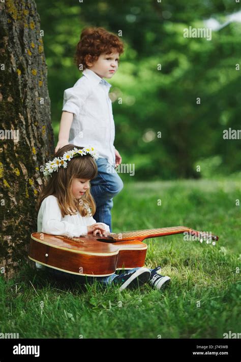 Cute Little Children Playing Guitar Stock Photo Alamy