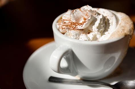Cup Of Cappuccino With Fresh Whipped Cream And Cinnamon On Top Stock