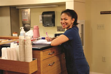 Smiling Female Nurse At A Work Station Masonic Homes