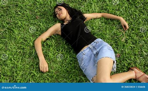 Erotic Asian Girl With Mini Skirt On Green Grass Stock Footage Video