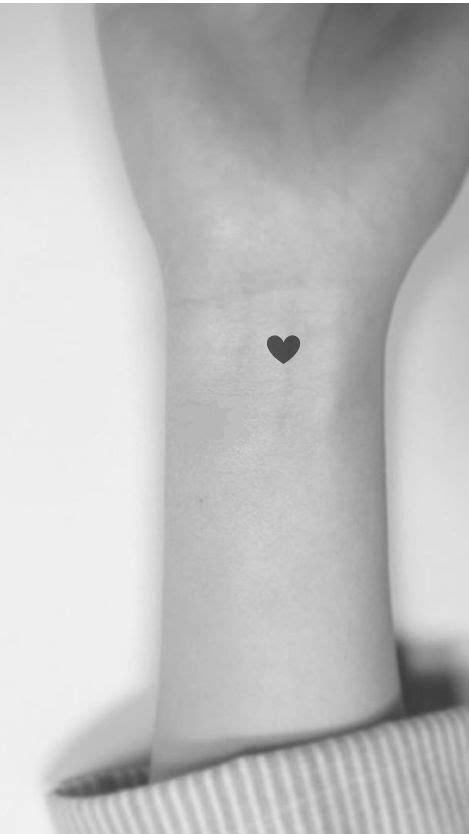 Wrist Tattoo Black Heart In 2020 Black Heart Tattoos Simple Wrist Tattoos Simple Heart Tattoos