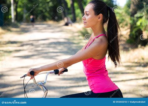 Woman Riding On Bicycle In Park Stock Photo Image Of Female Cute