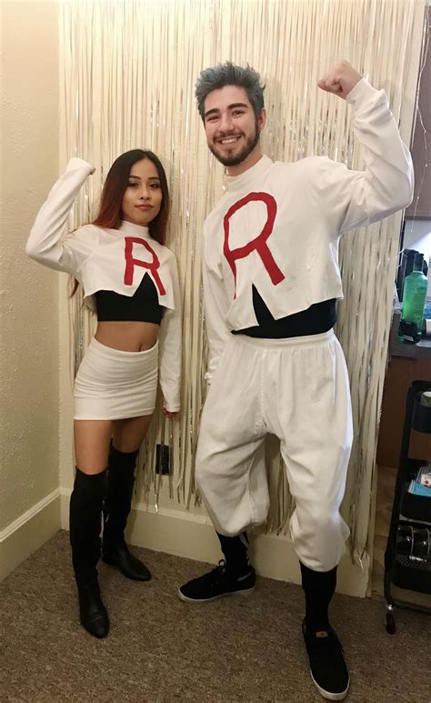 A Man And Woman Dressed Up In Costume Posing For A Photo With The Word Rr On Their Chest