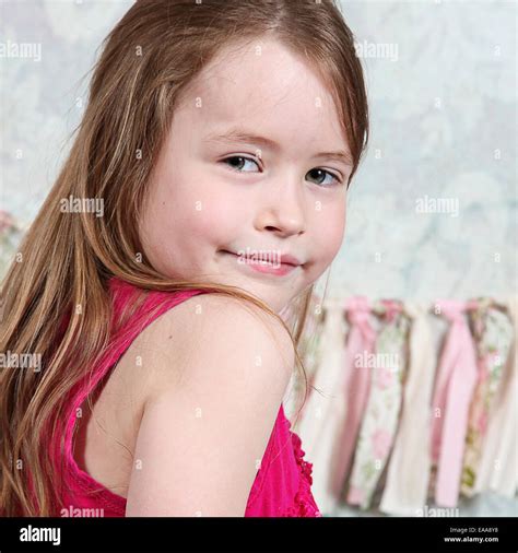 Beautiful Little Girl Posing For Camera In Studio Stock Photo Alamy