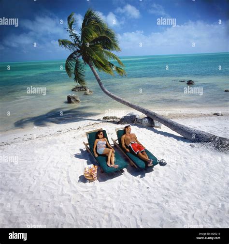 Couple Relaxing On Tropical Beach Stock Photo Alamy