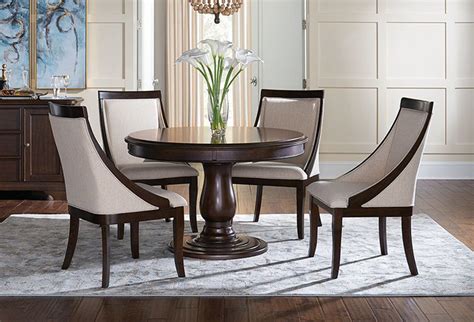 Explore chairs with rattan peel woven over a solid wood frame. Buy Jolie 5 PC Round Dining Room with Parsons Chairs - Part# | Badcock & More