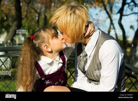 Mother And Daughter Kissing Stock Photo Alamy