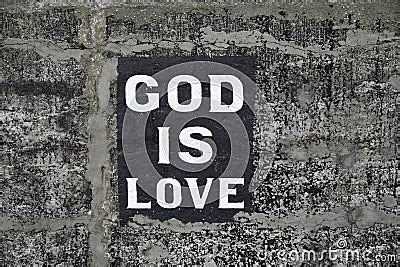Authentic God Is Love Sign Painted On Old Stone Harbour Wall Royalty