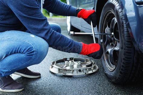 Man Changing Flat Tire On His Own Car Stock Photo Image Of Vehicle Wrench