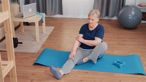 Active Senior Woman Stretching Body On Yoga Mat Old Person Pensioner