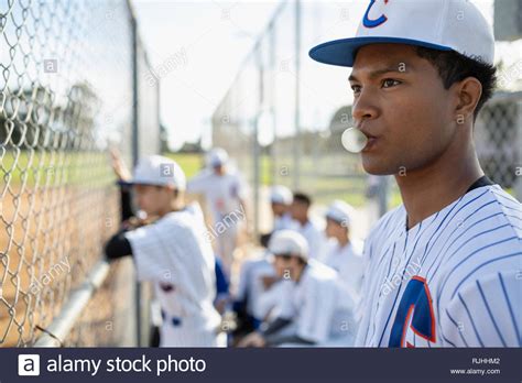 Baseball Player Blowing Bubble Gum Bubble Behind Fence Stock Photo Alamy