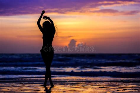 Dancing Silhouette Of Young Woman On The Sea Coast Stock Image Image