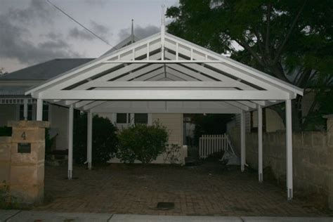 Building the roof of the double carport is a complex process, as the frame is very wide. I like the open trusses | Carport designs, House designs exterior, Roof trusses