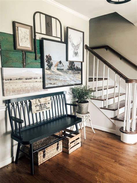 This is what we call entryway goals! Layer art and canvases to create a gallery wall- our new ...