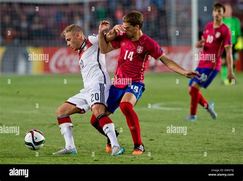 Max Meyer of Germany, left, and Darko Brasanac of Serbia fight for a