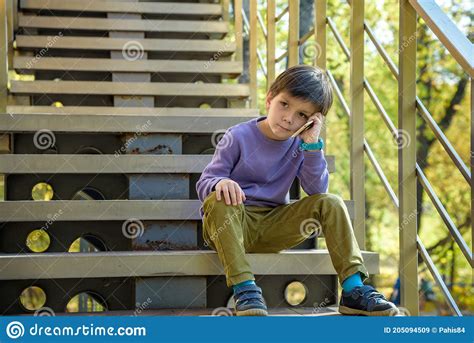 Closeup Portrait Worried Sad Young Child Boy Talking On Phone To
