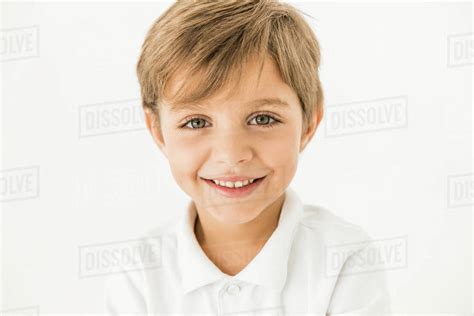 Close Up Portrait Of Adorable Happy Little Boy Smiling At Camera