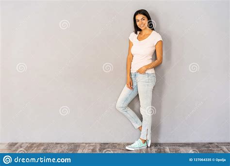 Full Body Portrait Of Happy Smiling Beautiful Young Woman