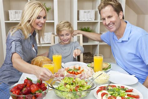 Parents who take care of their children to eat Stock Photo ...
