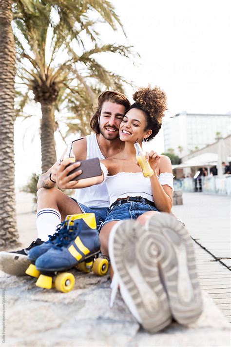 Cheerful Couple Making Selfie By Stocksy Contributor Guille Faingold Stocksy
