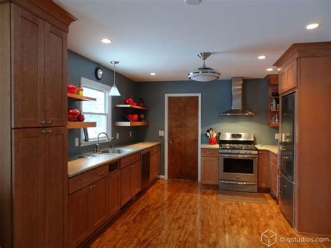 Versatility is the watch word in this landen kitchen featuring maple wood cabinets. Maple Kitchen Cabinets And Blue Wall Color Kitchen ...