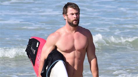 Chris Hemsworth Shows Off His Insanely Ripped Physique While Surfing In
