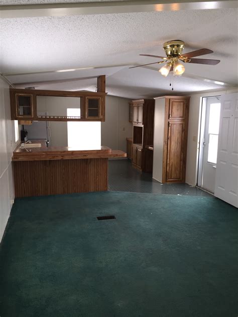 New kitchen and bath, ceramic tub surround, pine interior, living room with futon, 2 bedrooms one with a double and one with a futon, on the lake with a deck. Lot #49 Mobile Home Villa 1988 Champion 14×70 2 bedroom, 1 ...