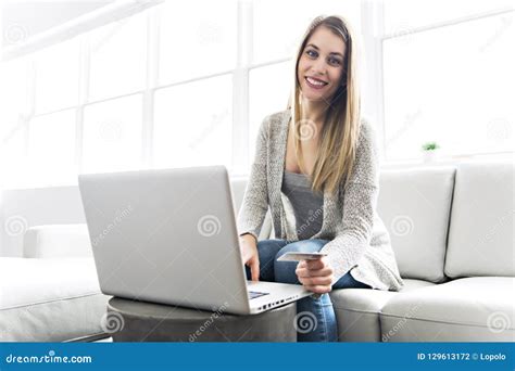 Young Woman On A Sofa On The Living Room Stock Photo Image Of