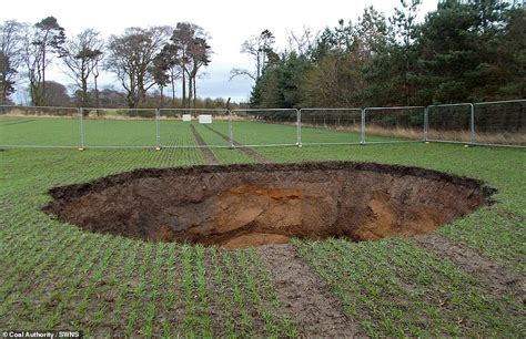 Investigation Is Underway After Giant Sinkhole 30ft Wide And 20ft Deep