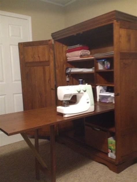 Especially with the drop down table. Sewing cabinet with table folded out | Sewing room design ...