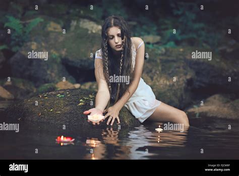 Beautiful Water Nymph In Forest Stream With Floating Candles Fantasy