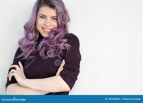 Adorable Young Woman With Wavy Purple Hair And Natural Makeup Looking