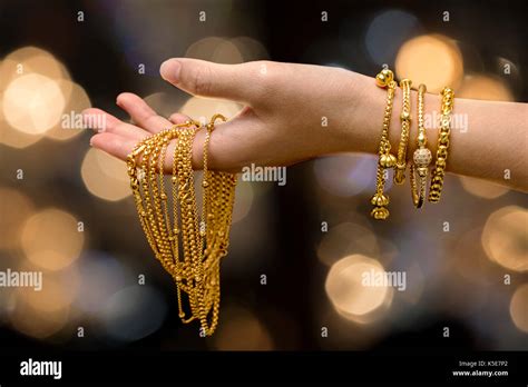 Woman Hand Hold Gold Bracelet And Necklace Jewelry Stock Photo Alamy