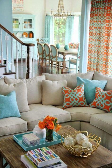 We Love This Vibrant Coastal Living Room Add Touches Of Orange And