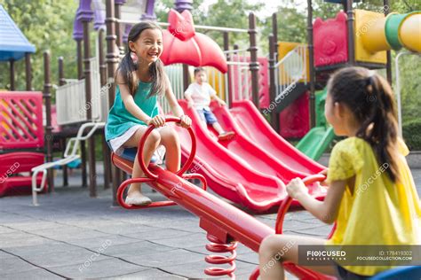 Chinese Girls Playing On Playground — Chinese Ethnicity Slide Stock