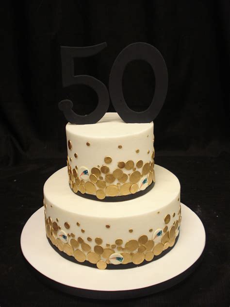 A 50th Birthday Cake With A Buttercream Base Gold Fondant Accents