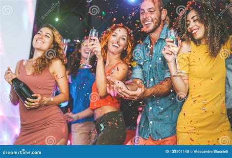 Happy Friends Doing Party Drinking Champagne And Dancing In The Club Millennials Young People