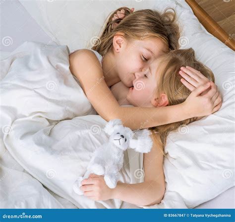 Two Little Sisters Hugging In Bed Stock Image Image Of Pleasure Girl 83667847