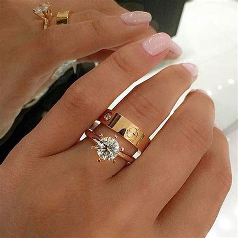 The cost of the ring will depend on the type of metal used to create the ring and the size of the cartier diamonds which are included in the design of the ring. I just adore this Diamond Engagement Ring + Cartier Love Ring Combination • #bridesjournal # ...