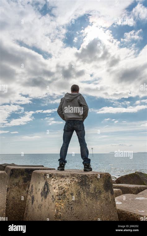 Man Standing On A Rock High Resolution Stock Photography And Images Alamy