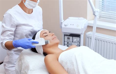 The Doctor Cosmetologist Makes The Apparatus A Procedure Of Ultrasound