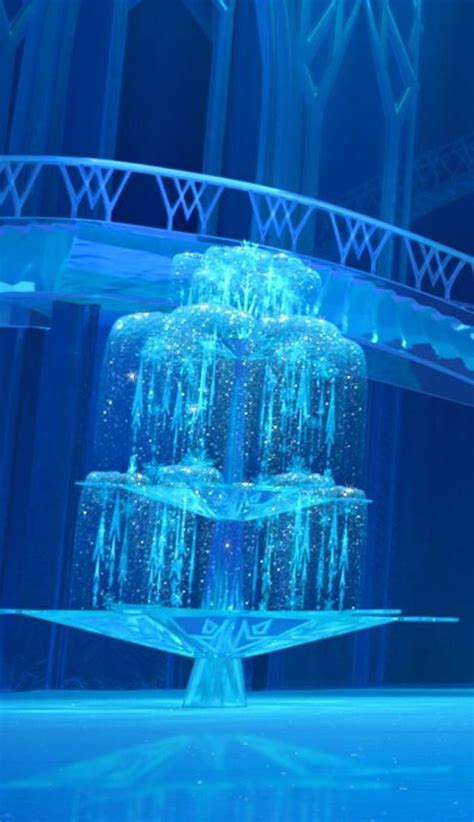 An Ice Sculpture In The Middle Of A Room With Blue Lights And Snow On It
