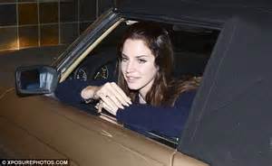 Lana Del Rey Poses Up Next To Her Classic Car While Parked Outside A