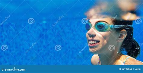 Child Swims In Pool Underwater Girl In Goggles Has Fun Stock Photo